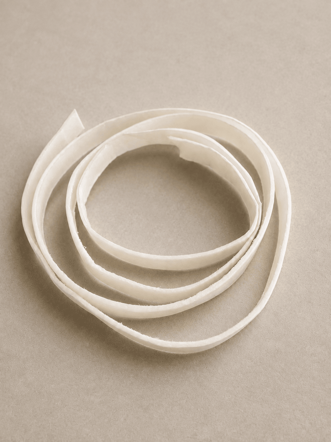 Processed bovine hide strip prepared for pet-chew manufacturing